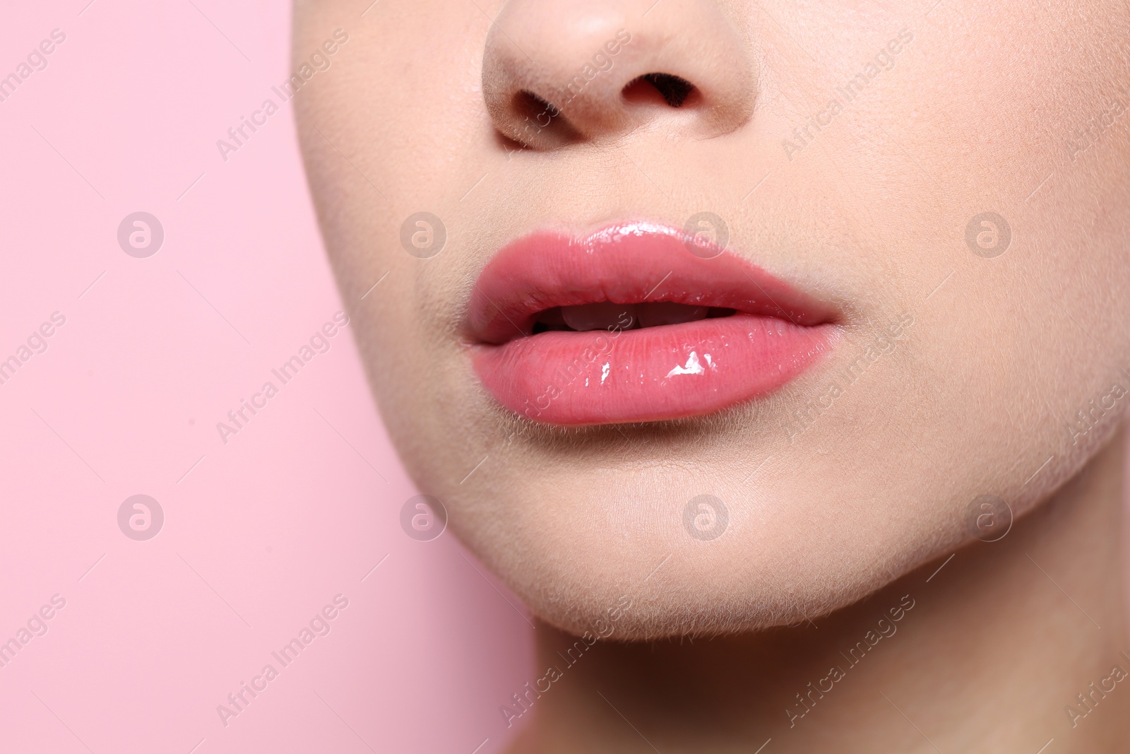 Photo of Beautiful young woman with perfect lips makeup on color background, closeup