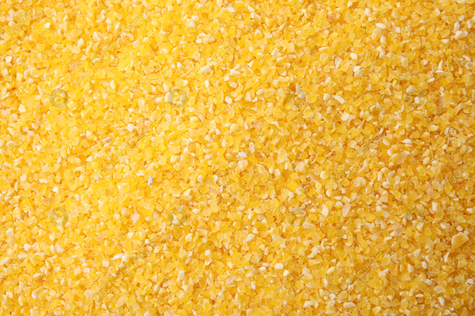 Photo of Raw corn grits as background, top view