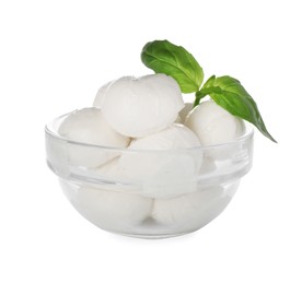 Photo of Bowl with mozzarella cheese balls and basil on white background