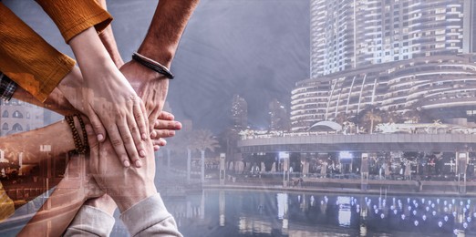 Partnership, cooperation, collaboration. Double exposure of night cityscape and people joining hands. Banner design