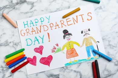 Photo of Beautiful drawing on white marble table, flat lay. Happy Grandparents Day