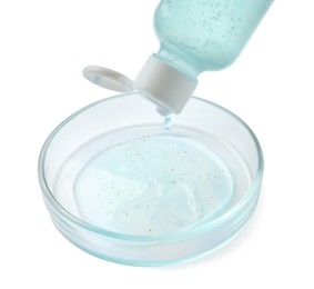 Photo of Dripping cosmetic product into Petri dish on white background