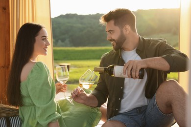 Romantic date. Beautiful couple with wine outdoors on sunny day