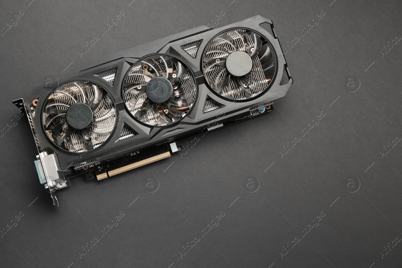 Photo of One graphics card on black background, top view. Space for text