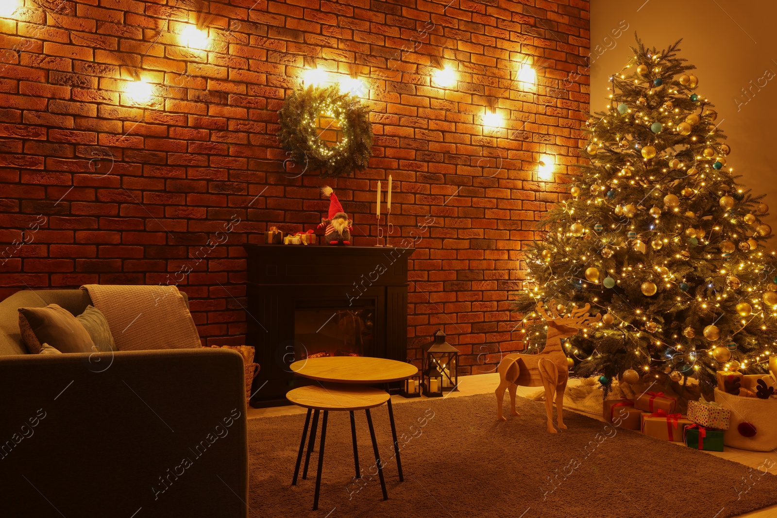 Photo of Beautiful tree with festive lights and Christmas decor in living room. Interior design