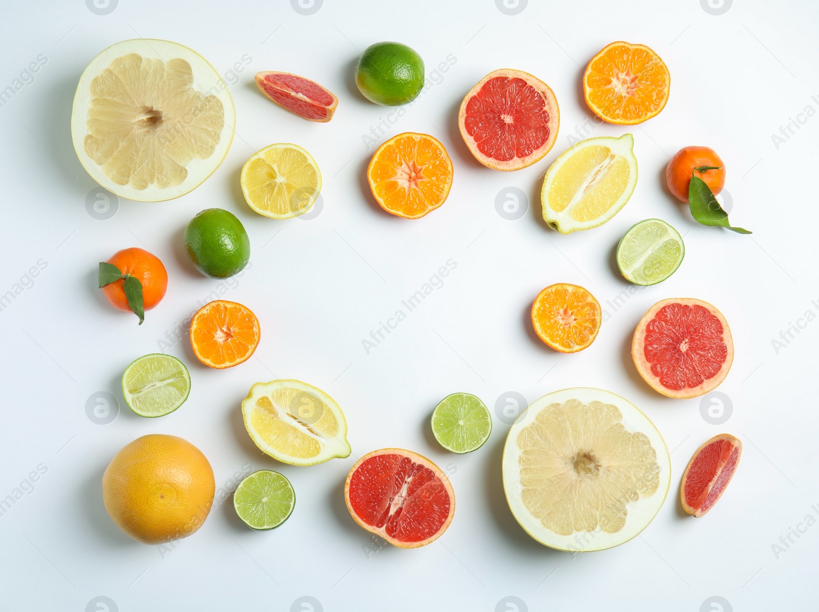 Photo of Different citrus fruits on white background, flat lay. Space for text