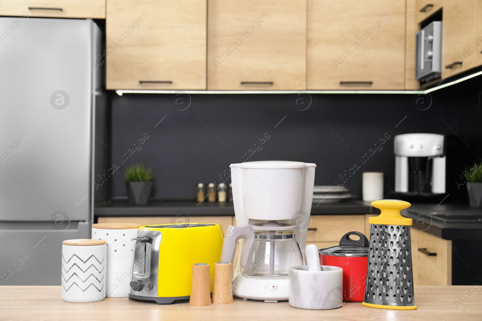 Photo of Set with modern domestic appliances in kitchen