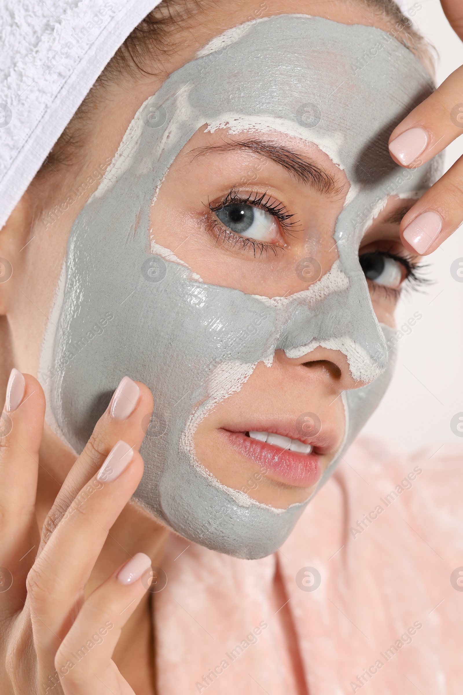 Photo of Woman with face mask on white background, closeup. Spa treatments