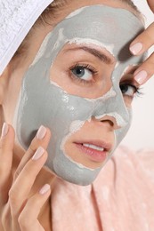 Photo of Woman with face mask on white background, closeup. Spa treatments