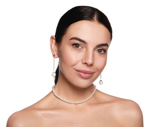 Photo of Young woman wearing elegant pearl jewelry on white background