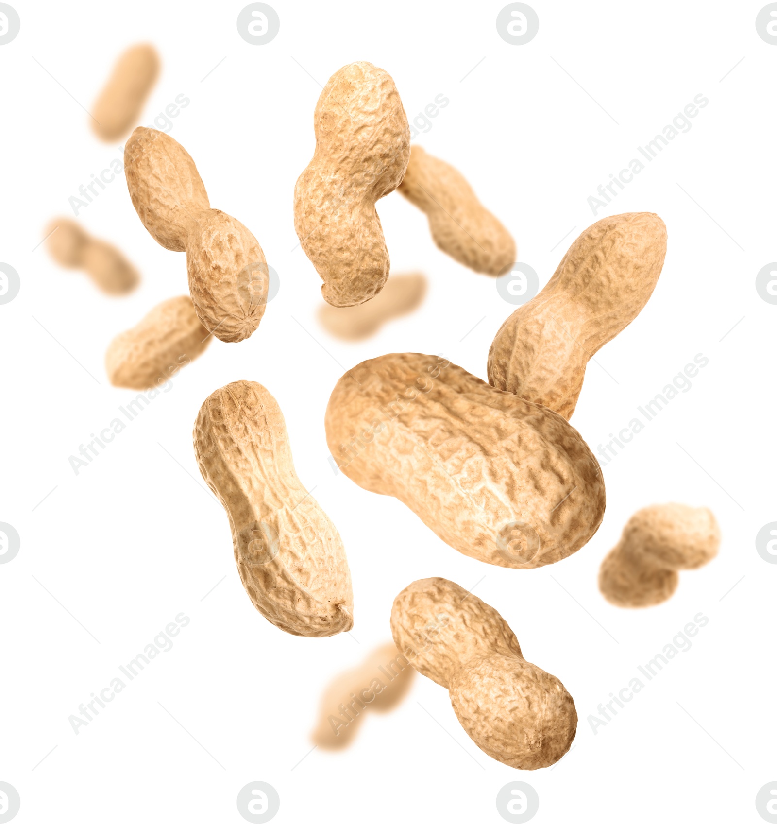 Image of Unpeeled peanuts in air on white background