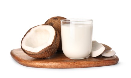 Photo of Glass of delicious vegan milk and coconuts on white background