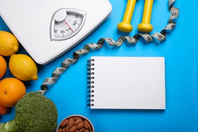 Photo of Notebook, measuring tape, fresh fruits and broccoli on light blue background, flat lay. Low glycemic index diet