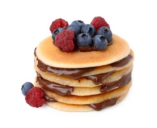 Photo of Stack of tasty pancakes with chocolate spread and berries isolated on white