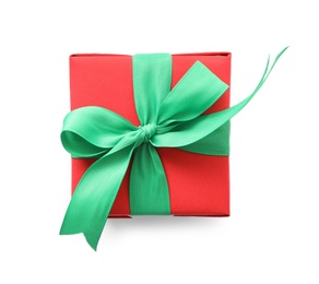 Photo of Christmas gift box decorated with green bow isolated on white, top view