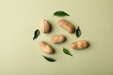 Photo of Composition with peanuts on color background, top view