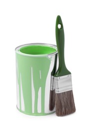 Can of light green paint and brush isolated on white