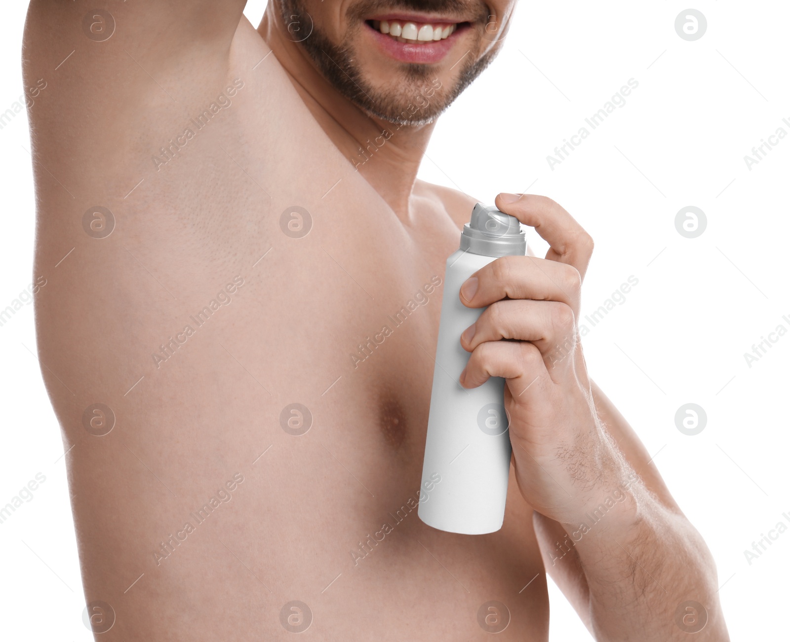 Photo of Man applying deodorant isolated on white, closeup