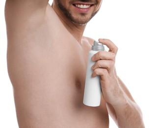 Man applying deodorant isolated on white, closeup