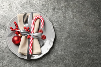 Photo of Beautiful Christmas table setting on grey background, top view. Space for text