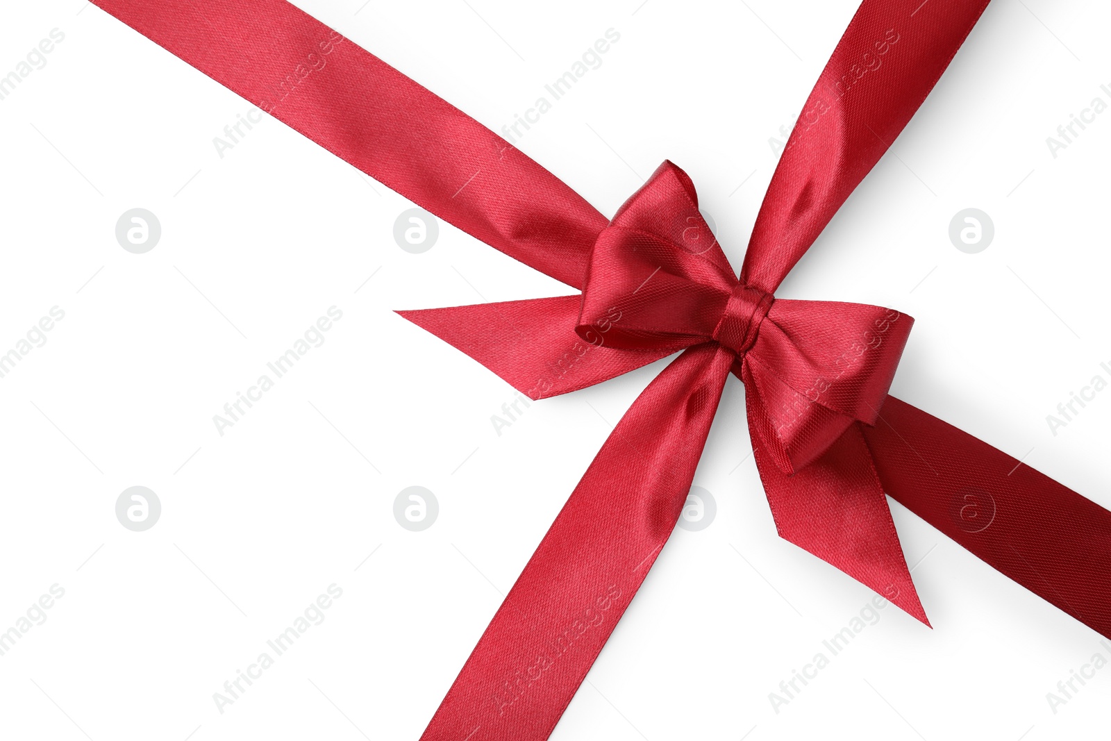 Photo of Red satin ribbon with bow on white background, top view