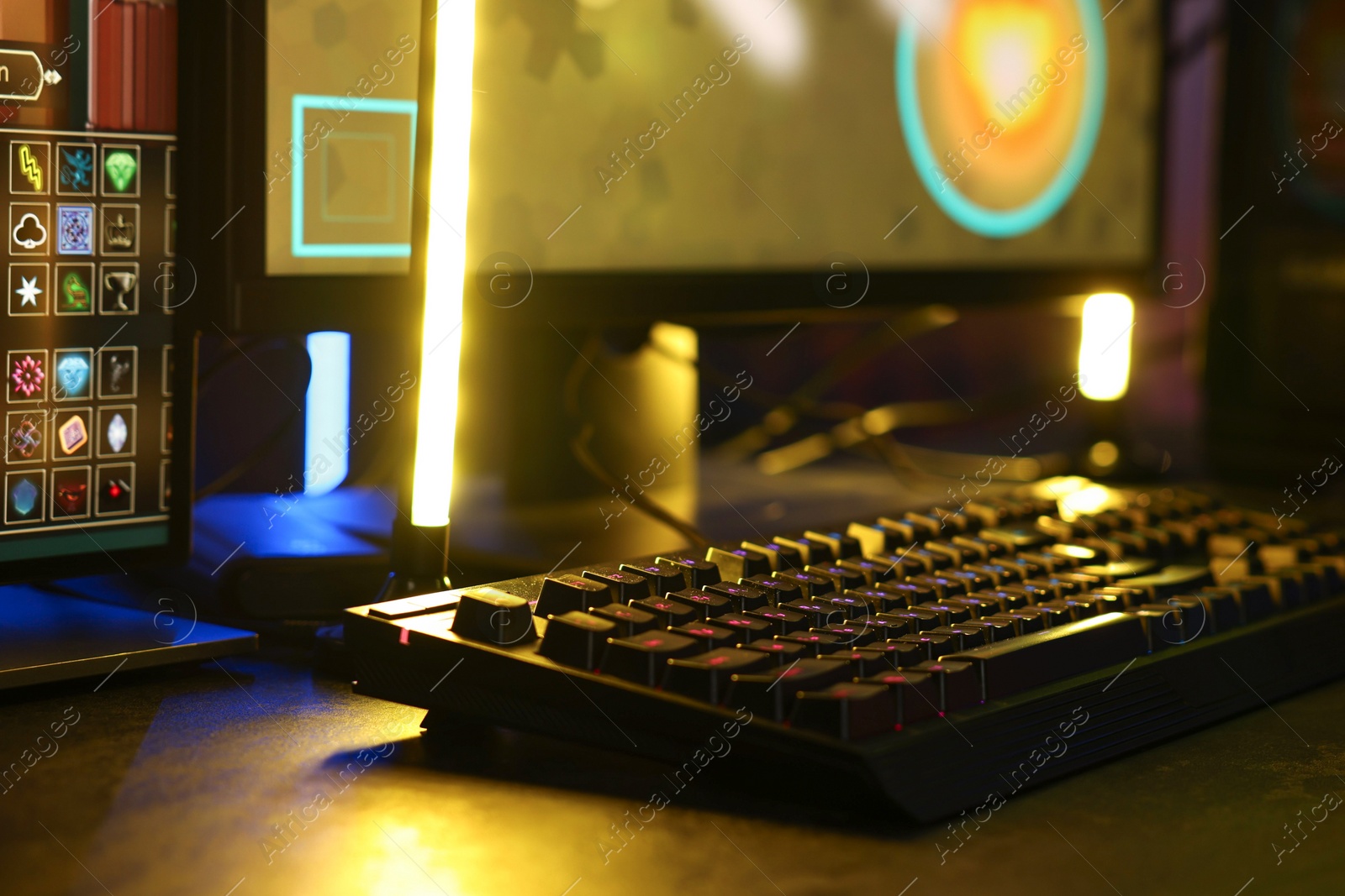 Photo of Playing video games. Computer monitor and keyboard on table indoors