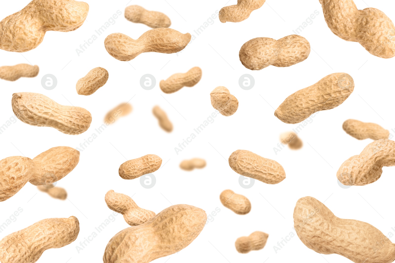 Image of Unpeeled peanuts in air on white background