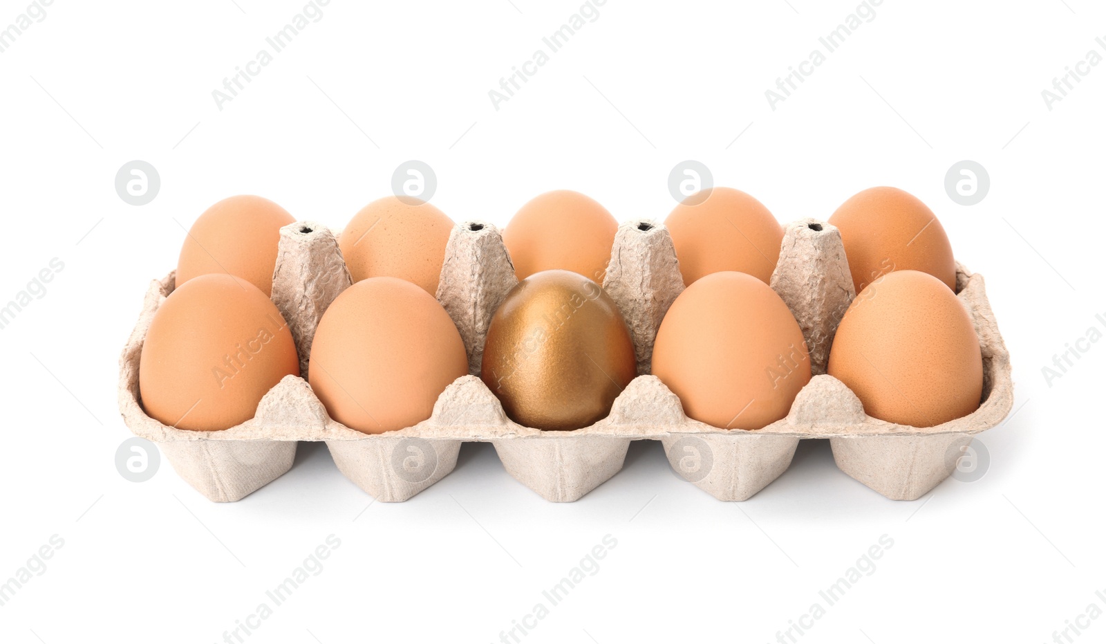 Photo of Eggs with golden one in carton on white background