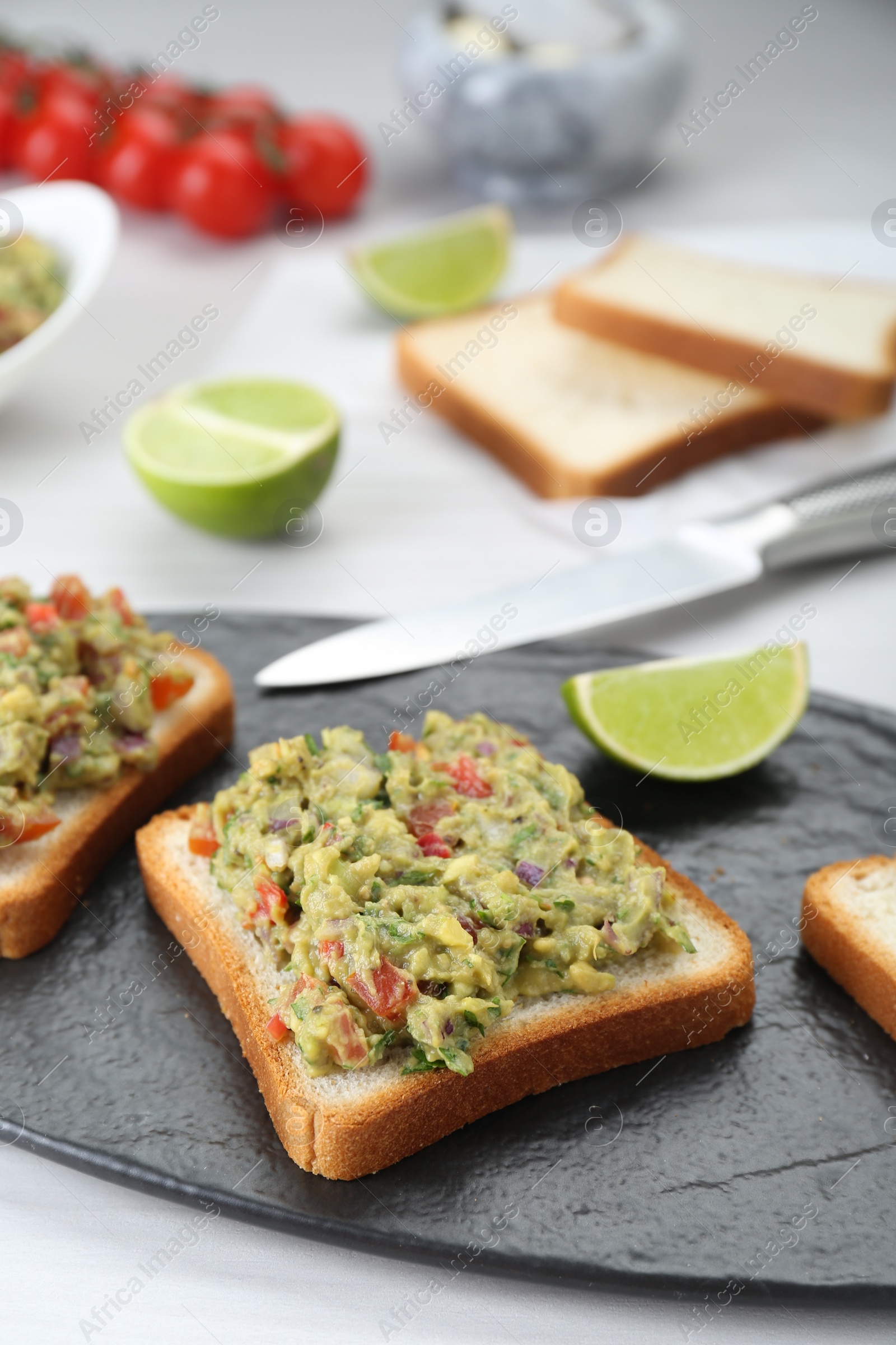 Photo of Delicious sandwiches with guacamole on white table, closeup