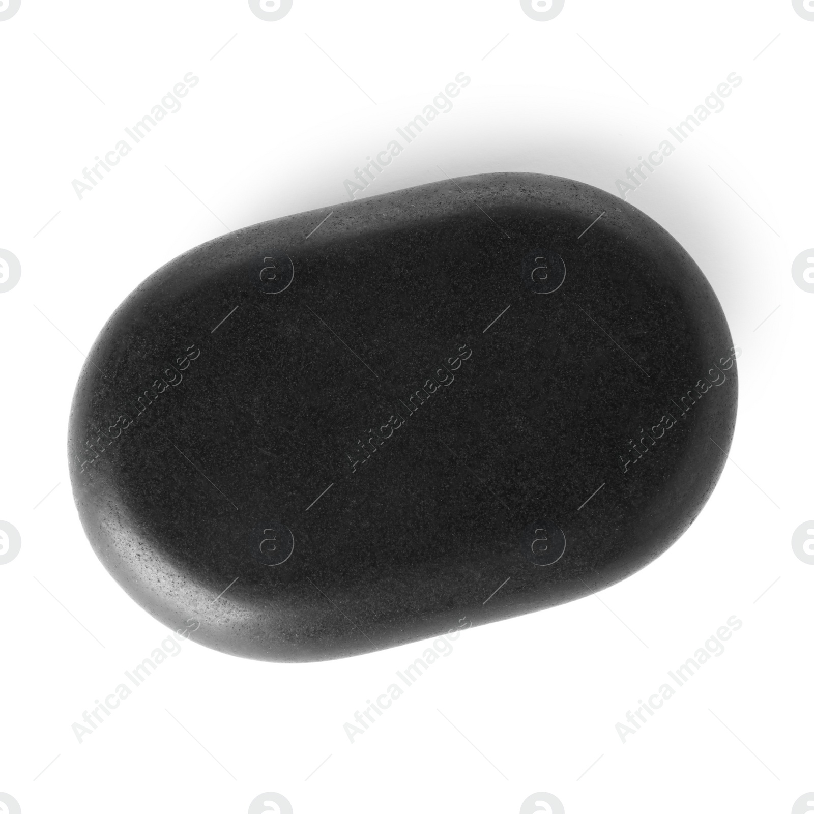 Photo of Black spa stone on white background, top view