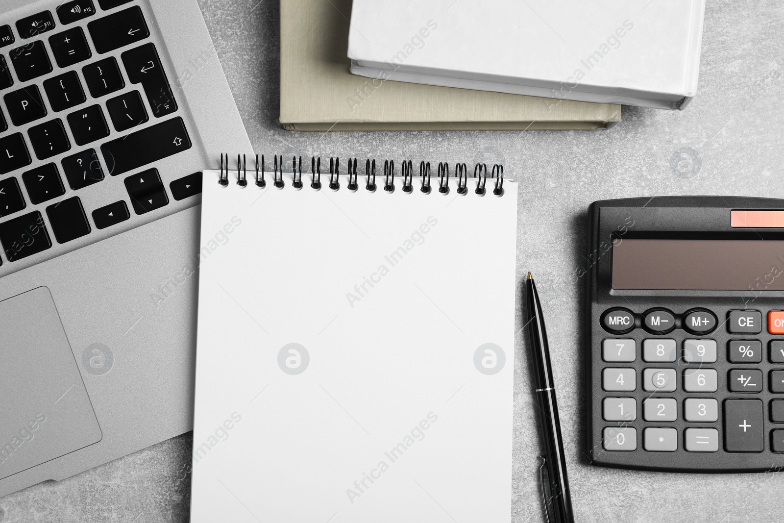 Photo of Flat lay composition with empty notebook on light grey table