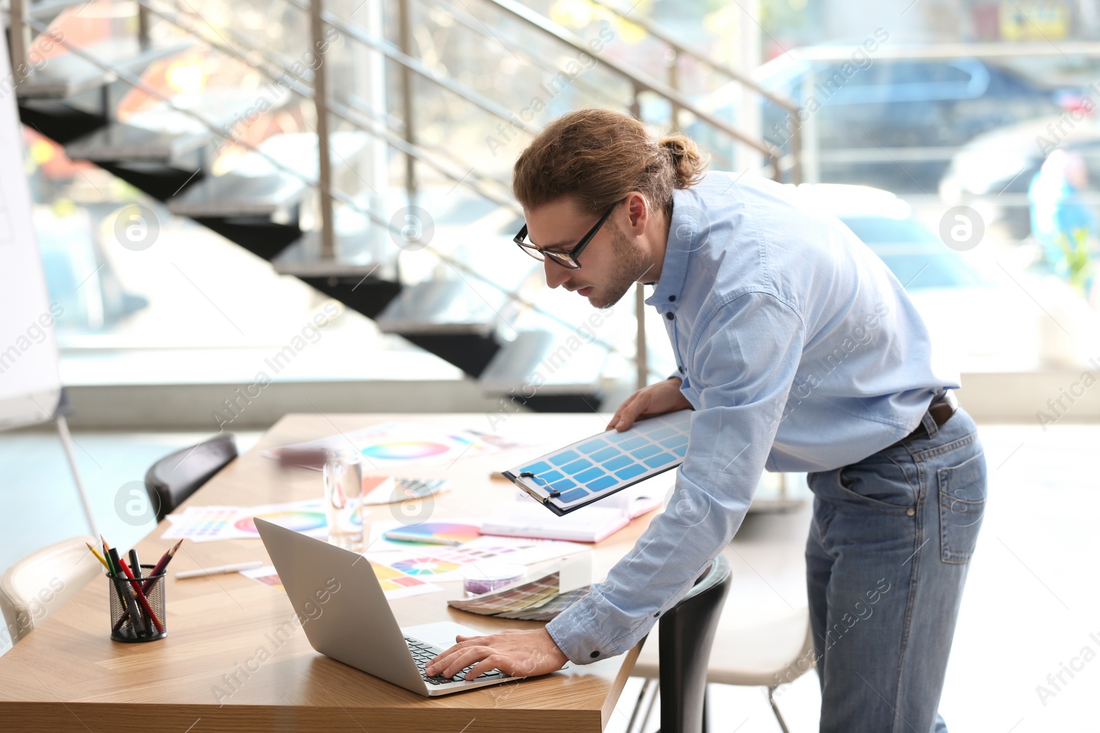 Photo of Professional interior designer at workplace in office