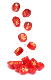 Image of Pieces of ripe red chili peppers falling into heap on white background 