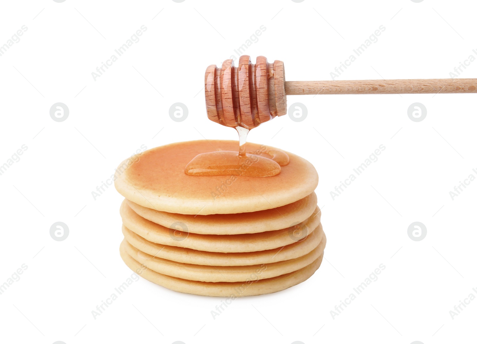 Photo of Pouring honey onto delicious pancakes on white background