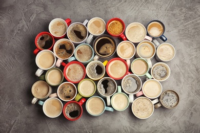 Photo of Flat lay composition with cups of coffee on grey background. Food photography