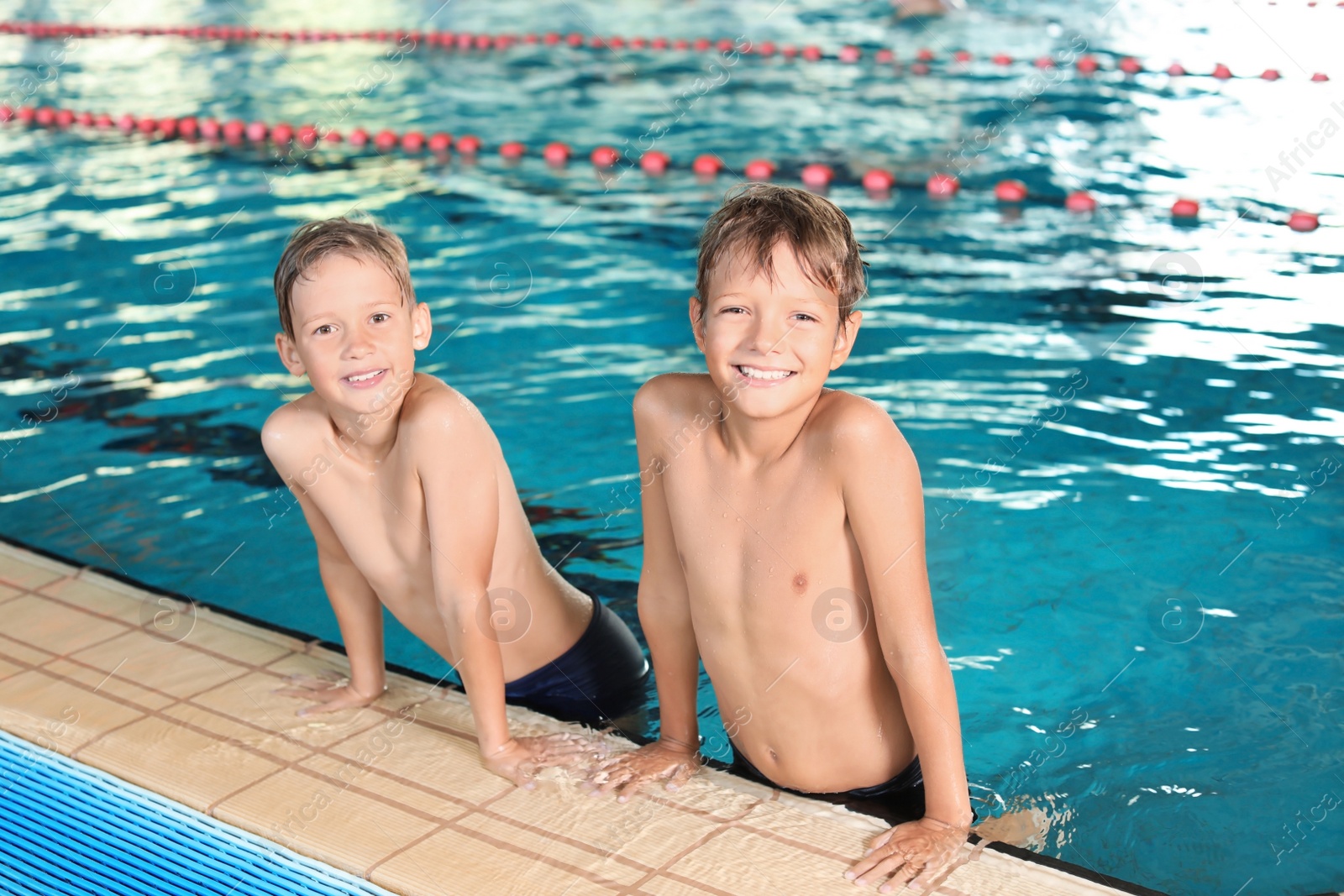 Photo of Cute little boys in indoor swimming pool