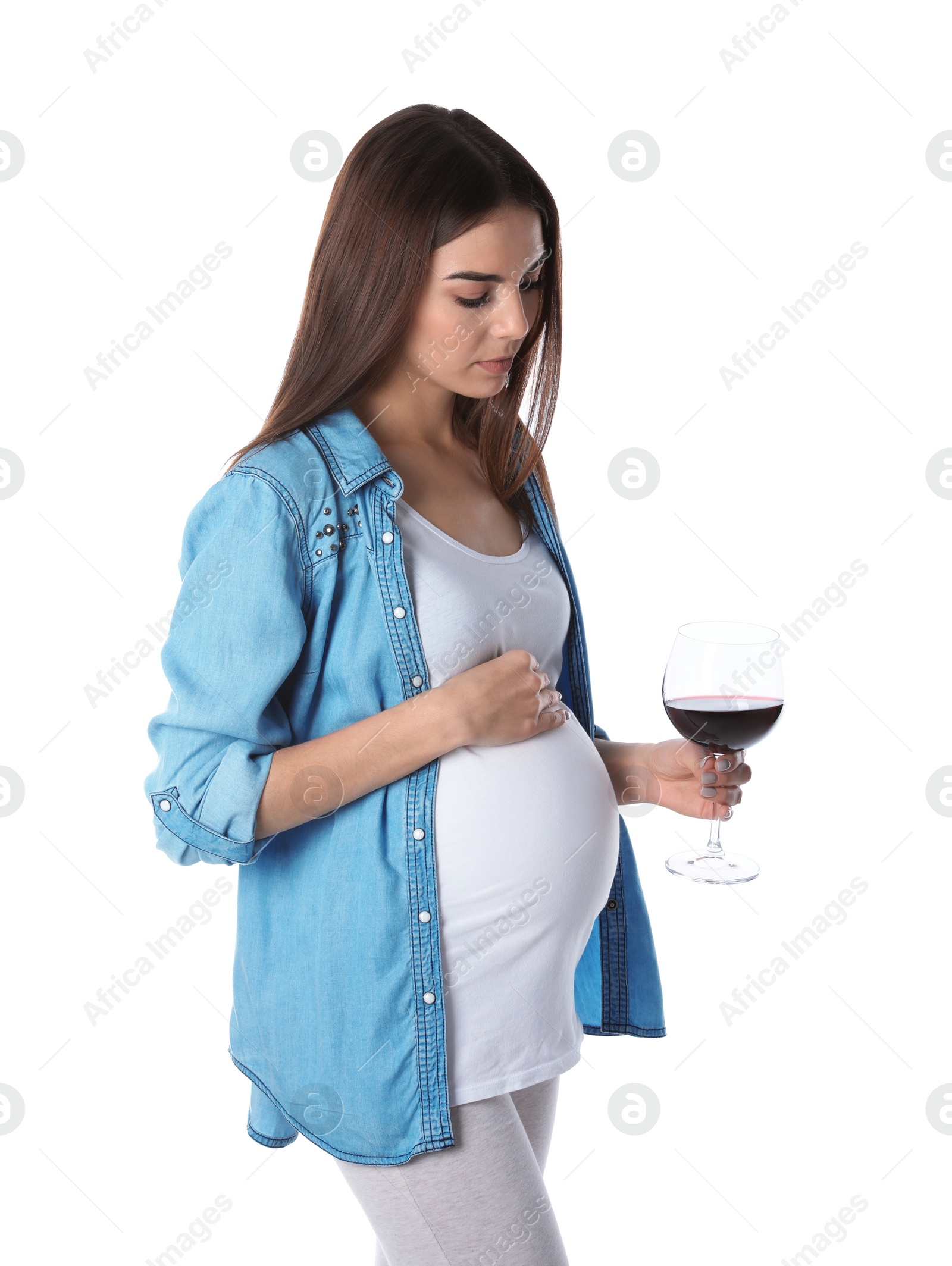 Photo of Future mother with glass of wine on white background. Alcohol abuse during pregnancy