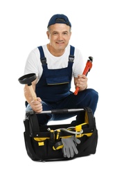 Photo of Mature plumber with pipe wrench and tool bag on white background