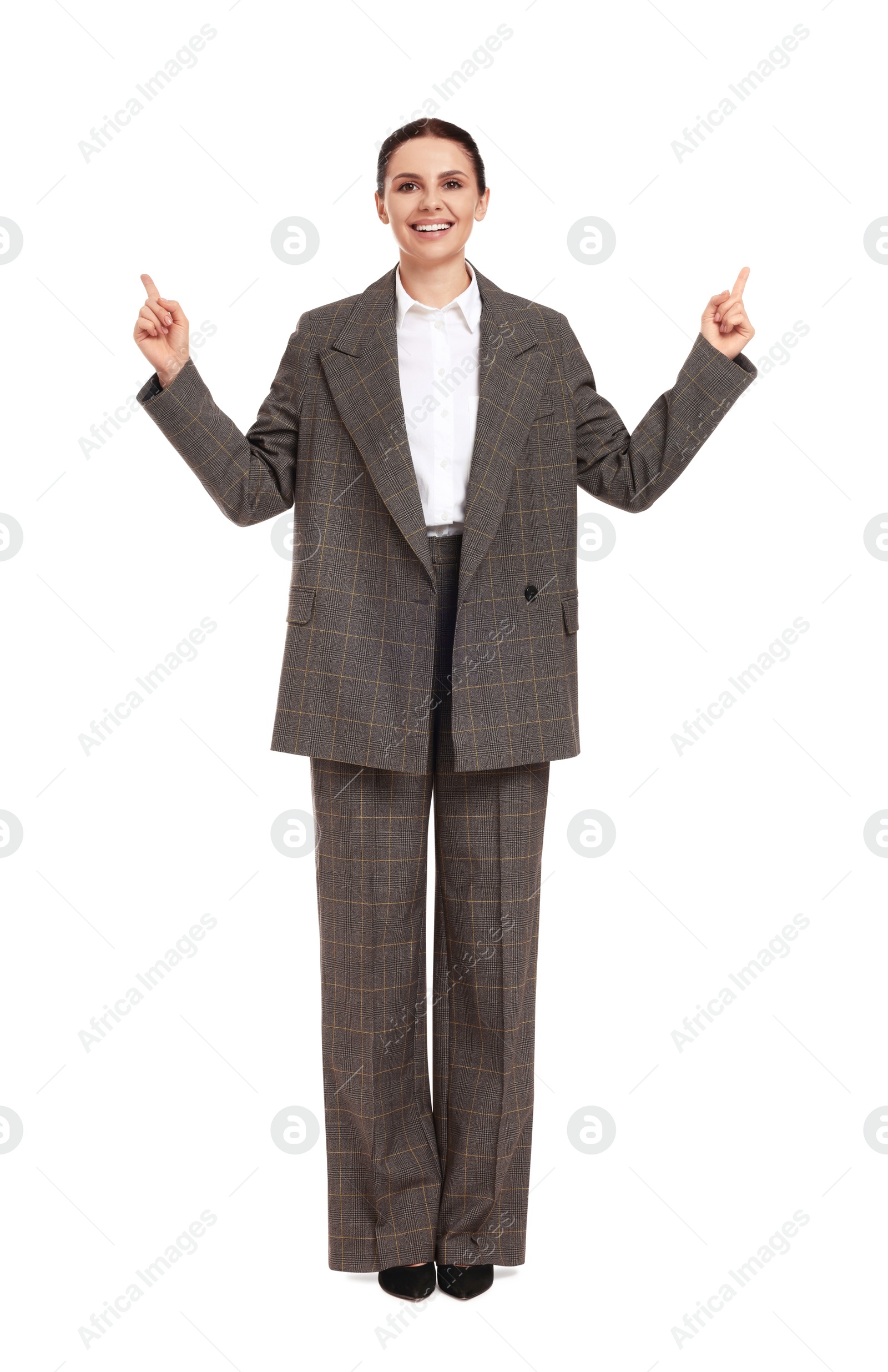 Photo of Beautiful businesswoman in suit pointing at something on white background