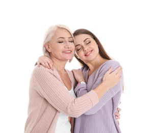 Photo of Portrait of young woman with her mature mother on white background