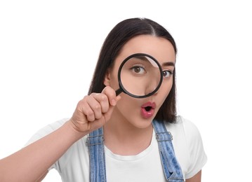Photo of Curious young woman looking through magnifier glass on white background