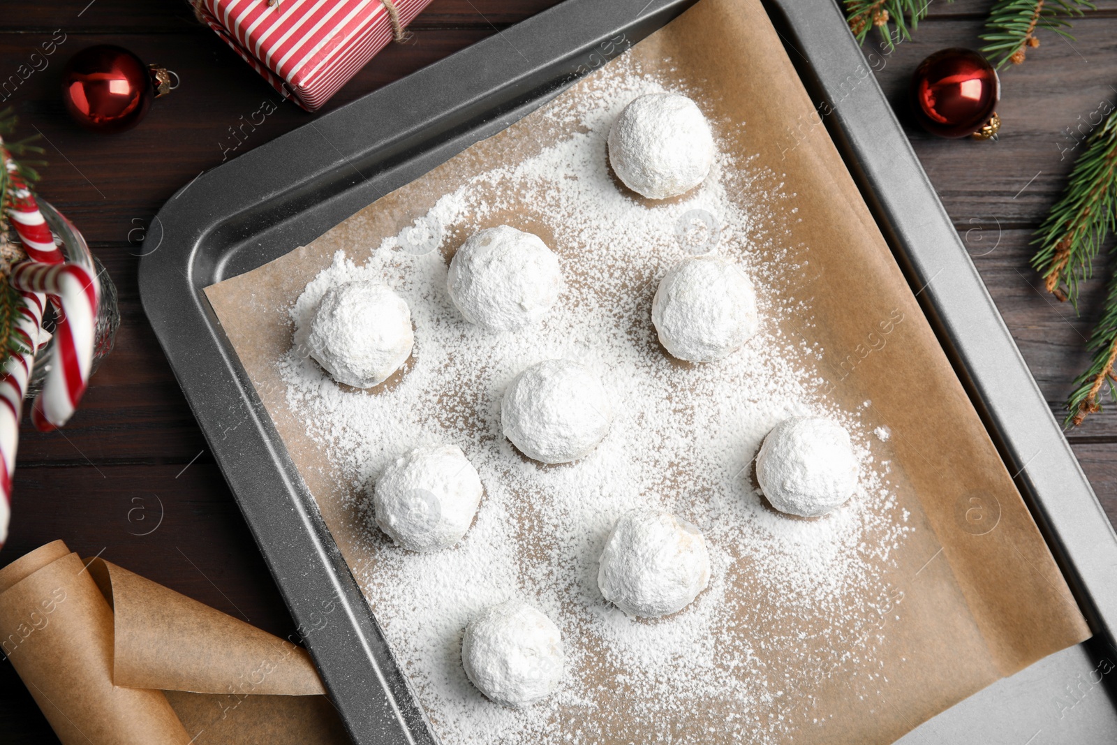 Photo of Flat lay composition with Christmas snowball cookies on table