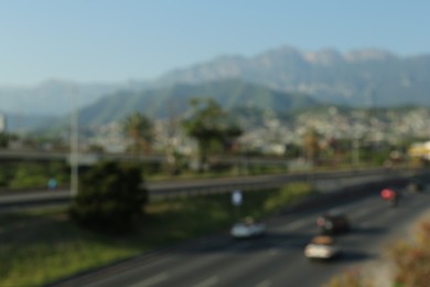 Blurred view of city and highway in mountains