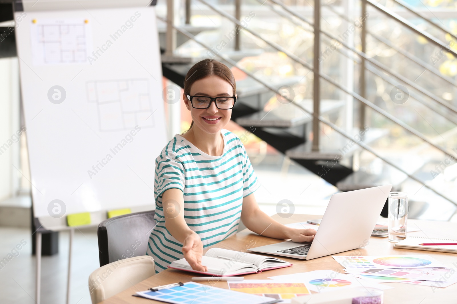 Photo of Professional interior designer at workplace in office