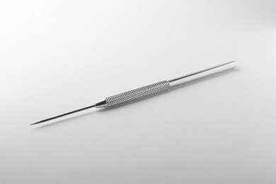 Photo of Stainless steel needle for clay modeling on white background