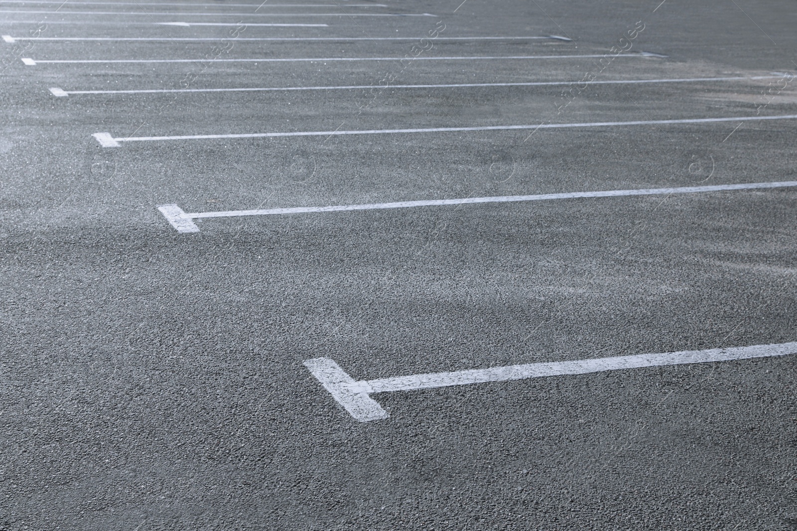 Photo of Car parking lot with white marking outdoors