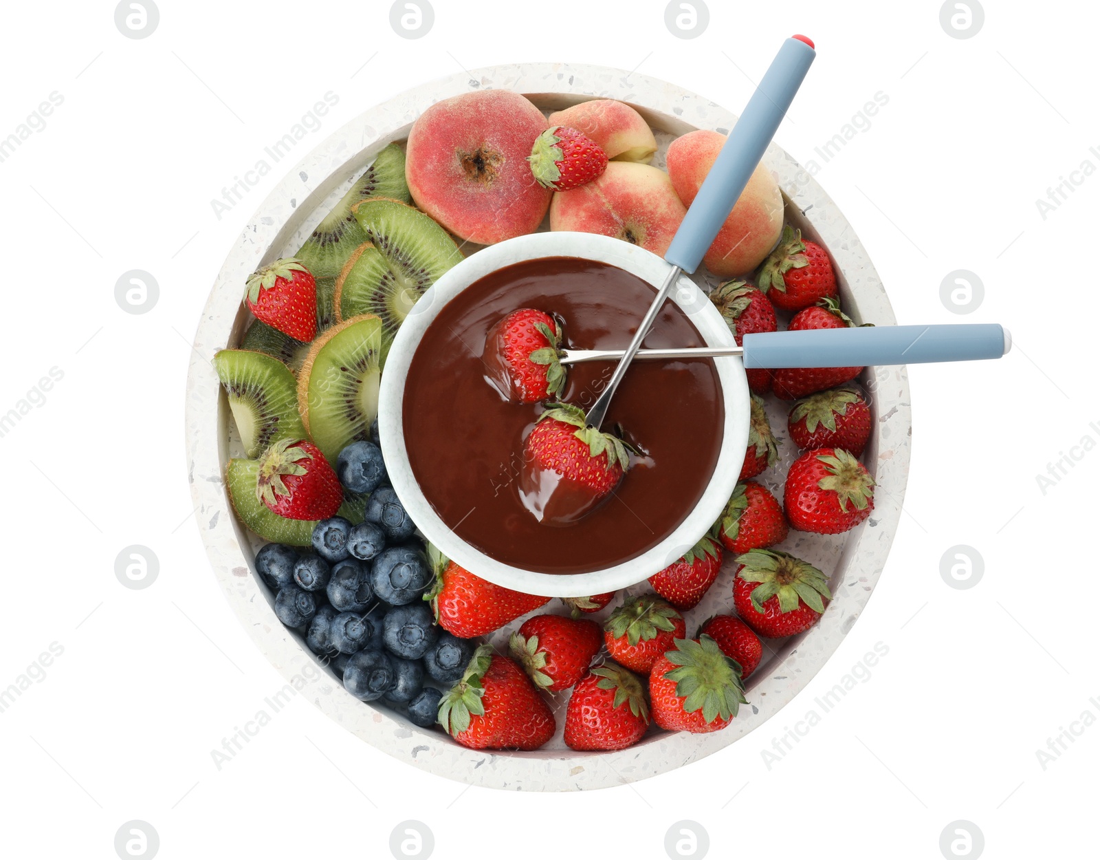 Photo of Fondue pot with chocolate and mix of fruits on white background, top view