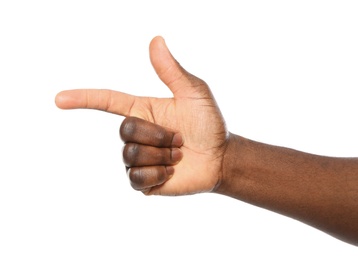 Photo of African-American man pointing at something on white background, closeup