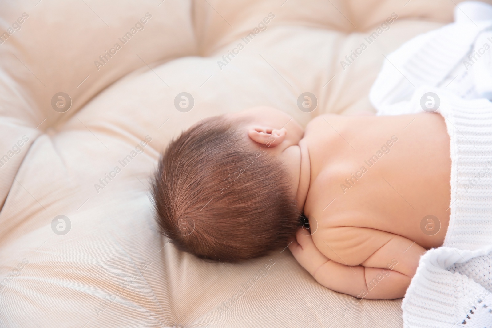 Photo of Adorable newborn baby sleeping in bed