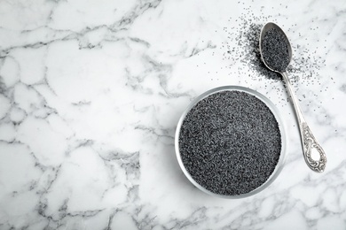 Flat lay composition with poppy seeds and space for text on marble background